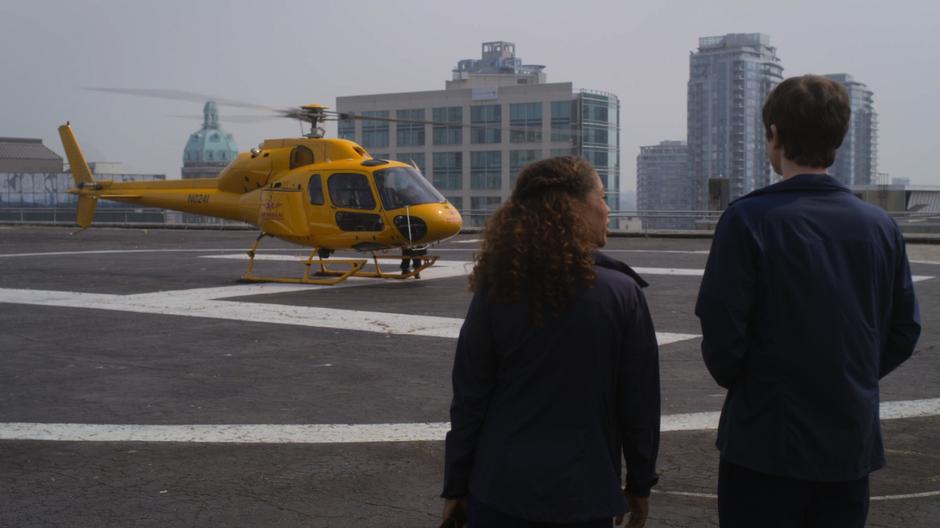 Shaun tells Claire that he likes helicopters while the police prepares the helicopter for flight.