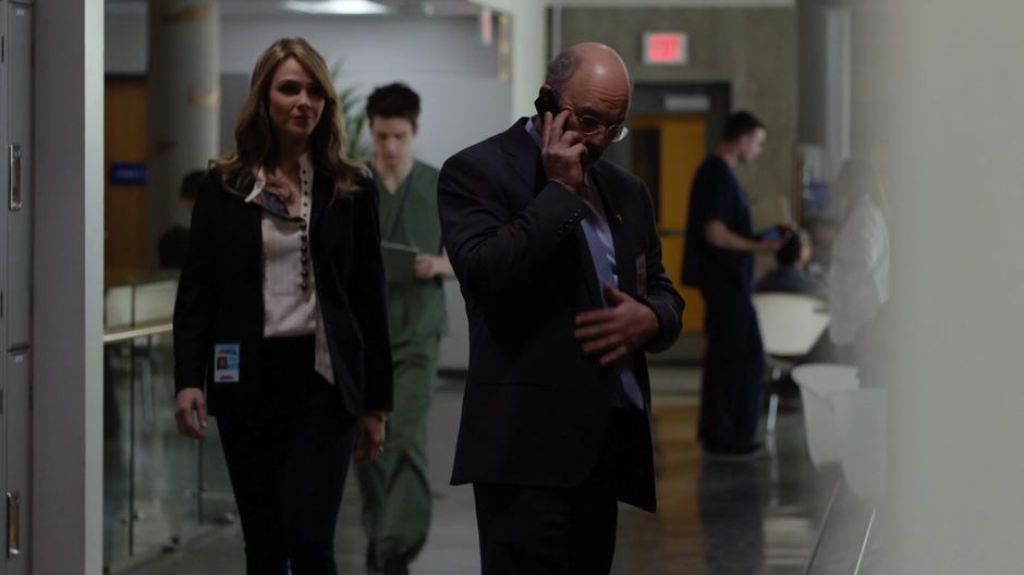 Dr. Glassman tries to reach Shaun on the phone as Jessica Preston walks up to him.