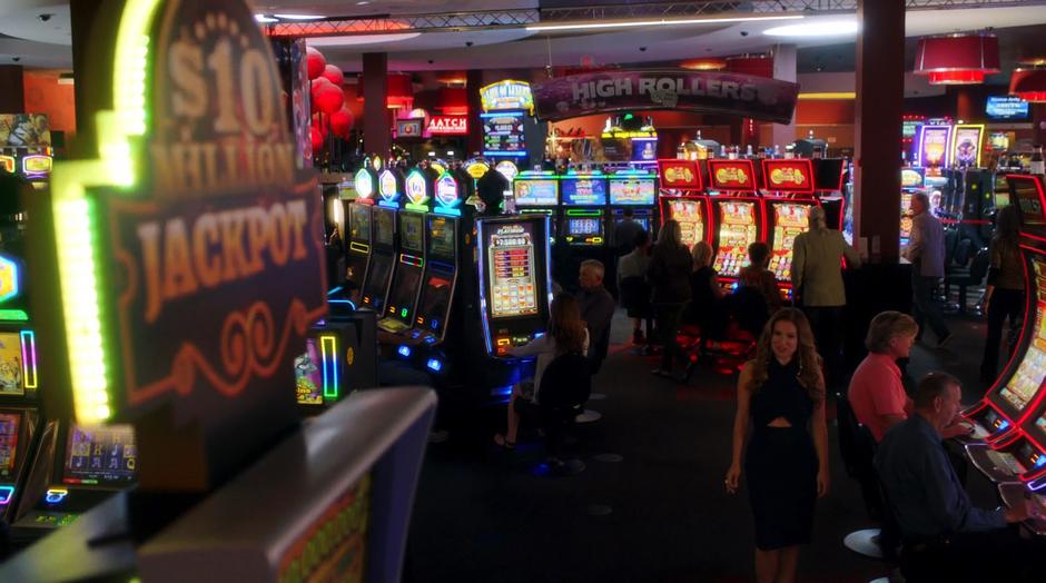 Rebecca Sharpe walks up to a slot machine with a $10-million dollar jackpot.