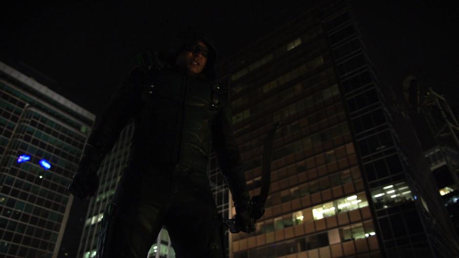 Diggle looks down from the upper roof and arranges a plan with Dinah.