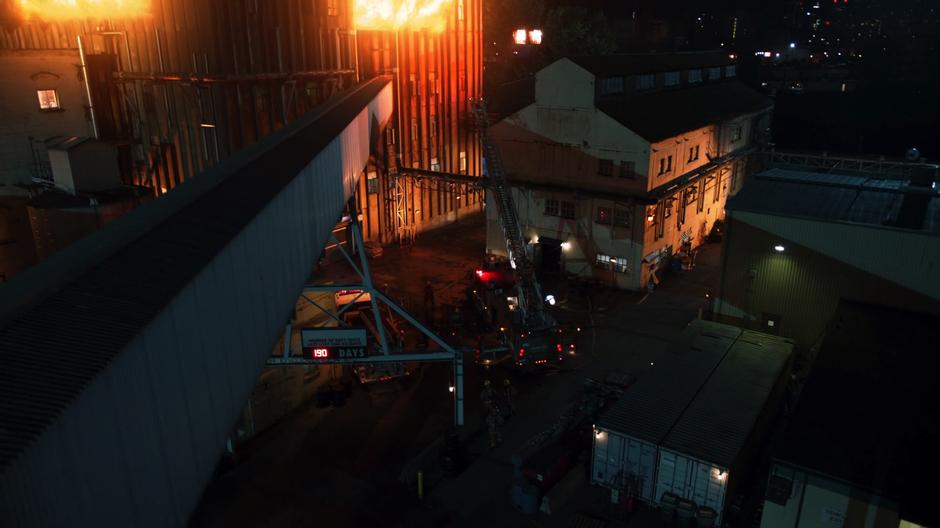 Firefighters work to put out a huge fire in a factory.