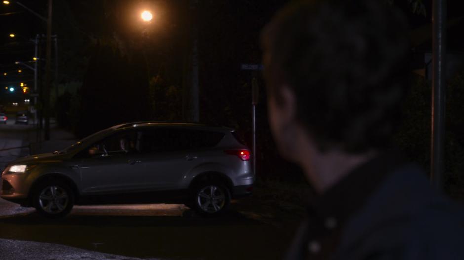Shaun turns towards Lea as she calls out from her car.