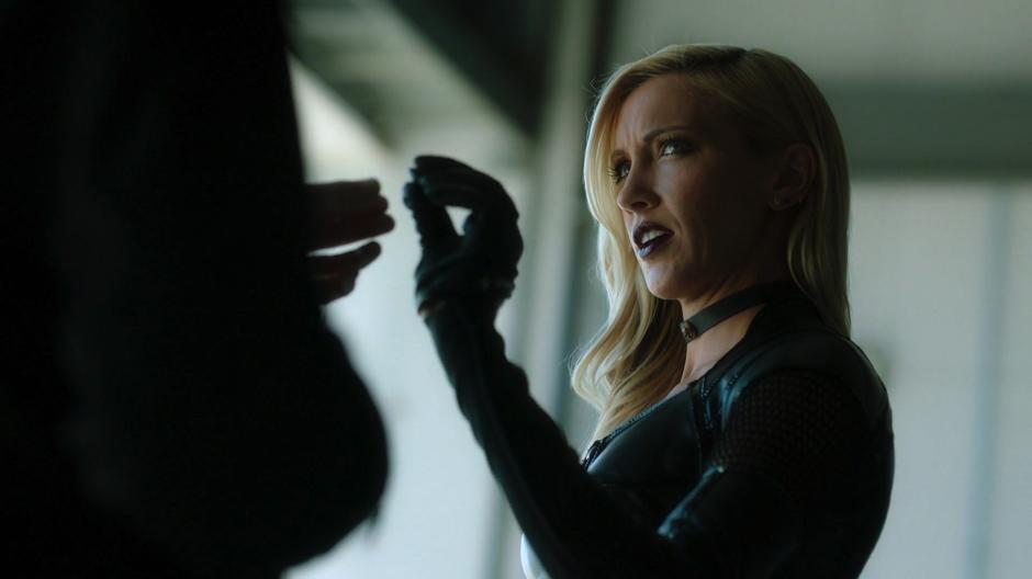 Black Siren takes the anti-tracking device from Cayden James.