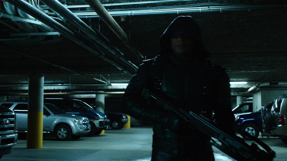 Diggle searches through the parking garage for Black Siren.