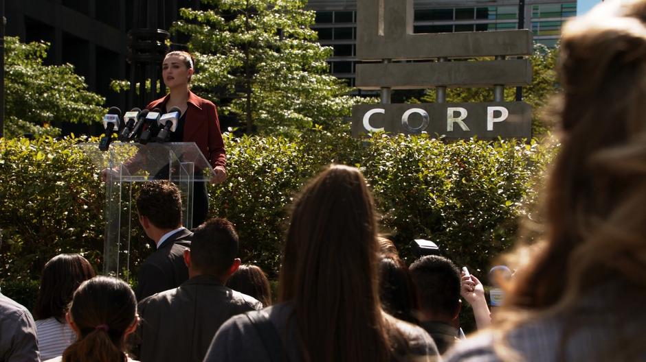 Lena talks about the sick kids from the lectern in front of the crowd.