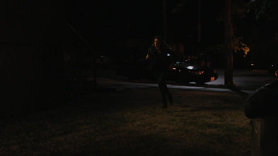 Dinah runs after the fleeing Vigilante.