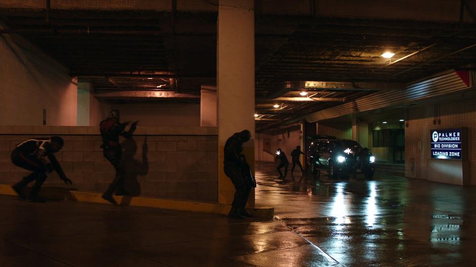 Curtis, Rene, and Diggle take cover while the goons fire at them.