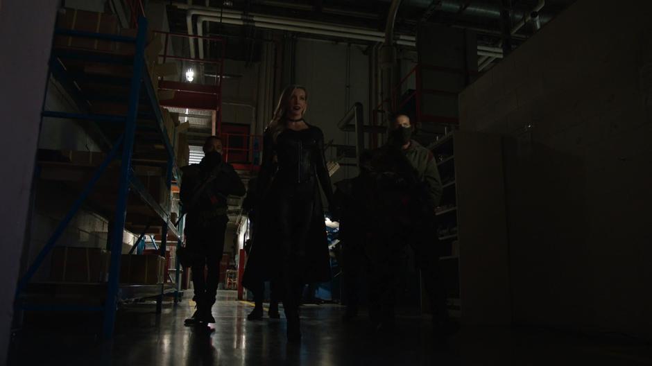 Black Siren leads her goons into the lab.