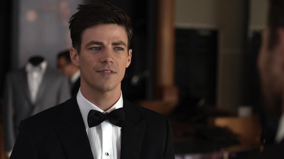 Barry listens to Oliver while wearing a fancy tux.