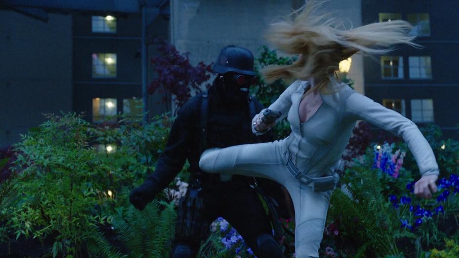 Sara kicks one of the Earth-X soldiers.