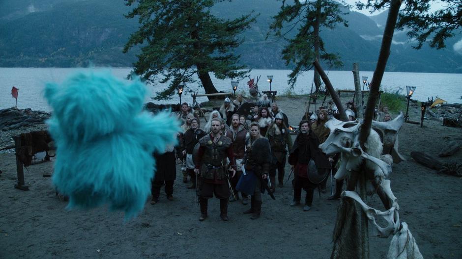Beebo hovers in front of the Vikings led by Leif and Freydis.