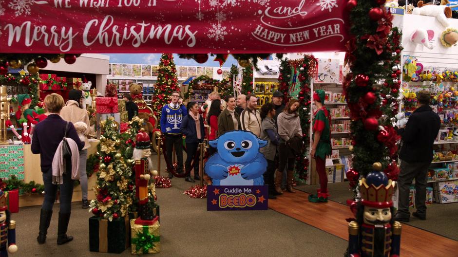 Young Stein talks to Clarissa on the phone while standing in line for a Cuddle Me Beebo toy.