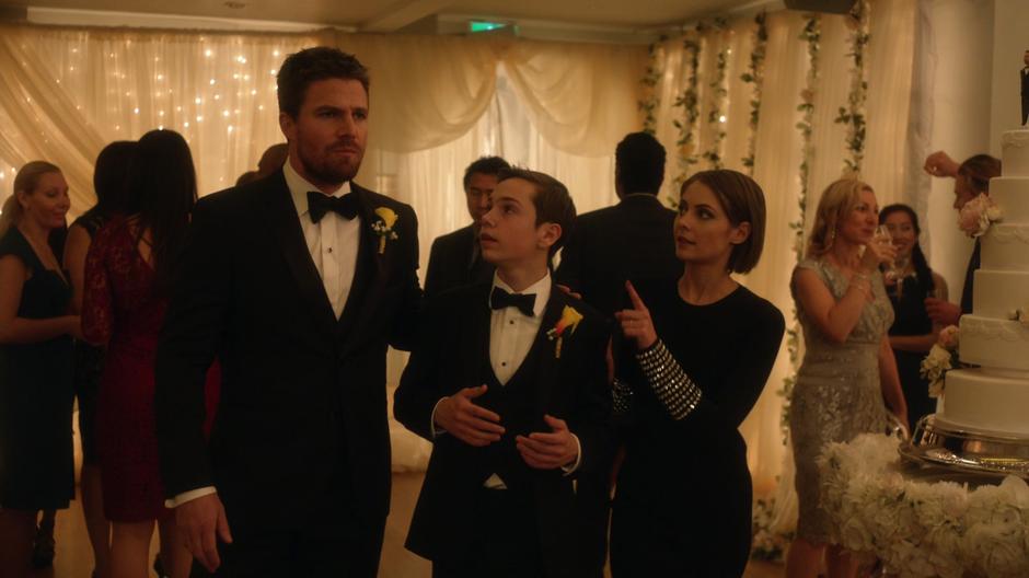 Oliver, William, and Thea chat during the reception.