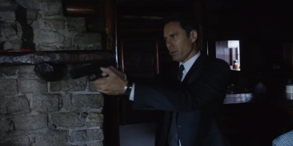 Grant comes into the cabin with his gun out.