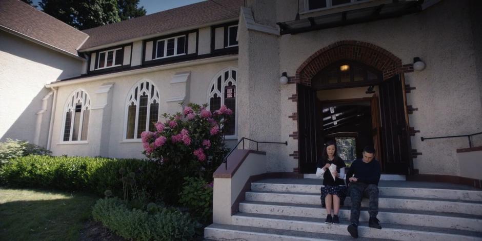 Grace eats some "French cuisine" while sitting outside with Trevor.