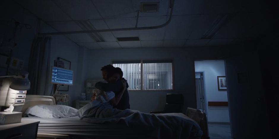 Grant hugs Kat in the hospital room after getting the bad news.