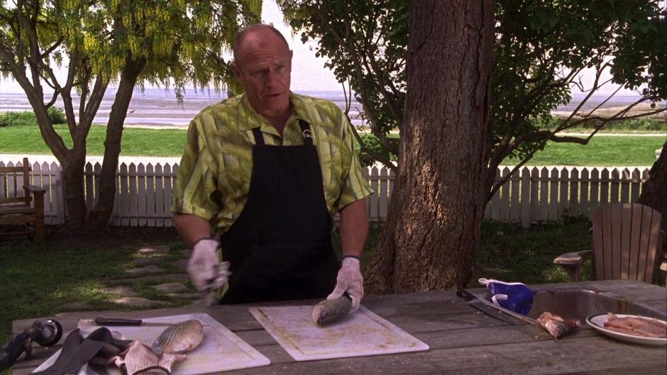 Henry asks Shawn to help him with gutting some fish.