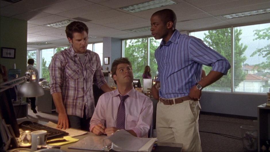 Shawn and Gus talk to one of the paper's employees about Vince Wagner.