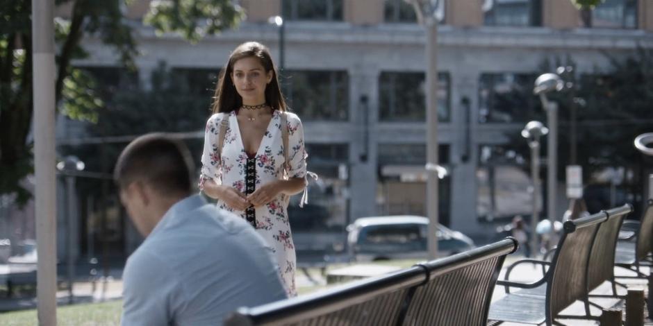 Rene approaches Trevor where he waits on a bench in the park.