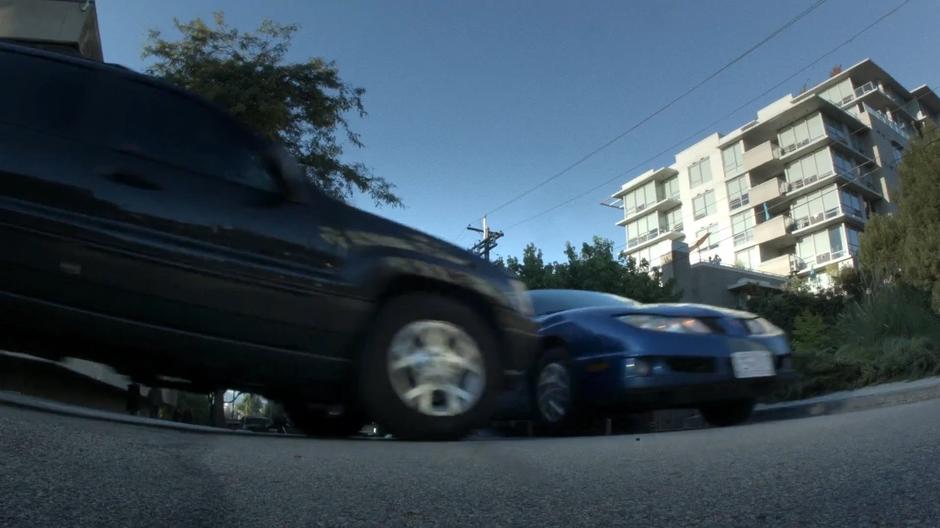 Scully crashes into another car in the intersection.