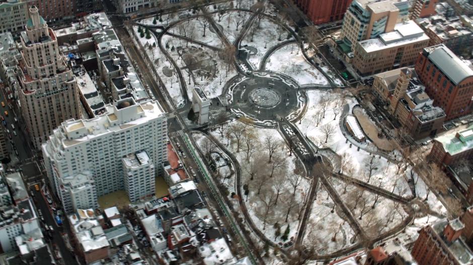 Aerial establishing shot of the park covered in snow.