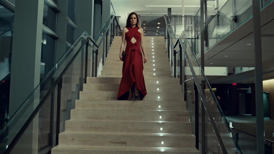 Mary walks down the steps in the lobby after watching her client die.