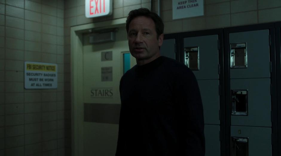 Mulder tells Scully that they should avoid the elevator.