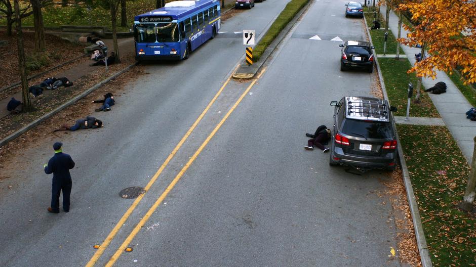 Neil Borman looks around at all of the people who have collapsed in the street.