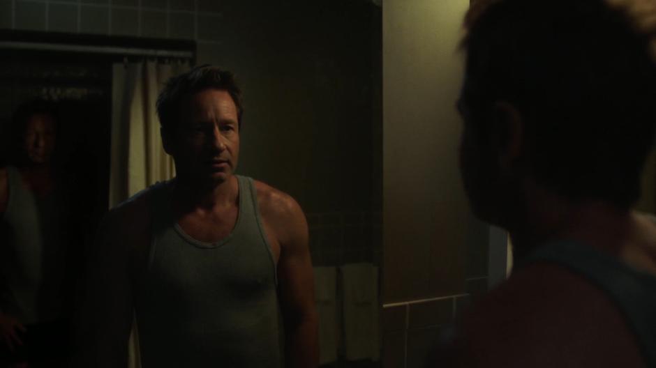Mulder sees his own doppelgänger in the mirror reflection in the bathroom.