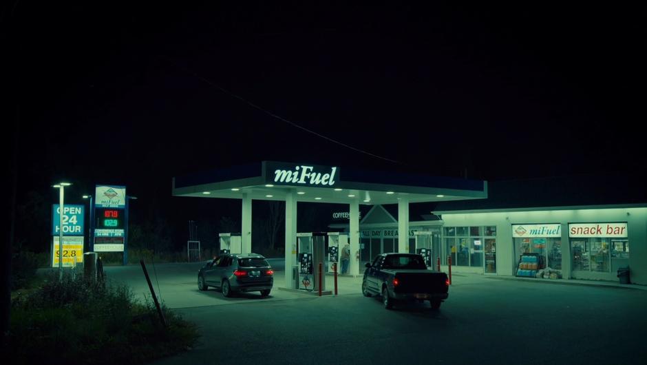 Ben pulls his truck into the gas station while Mary stops at the gas pump.