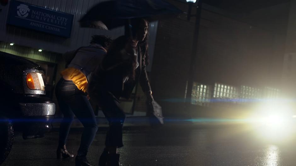 Julia Freeman pushes her friend out of the way of the oncoming car.