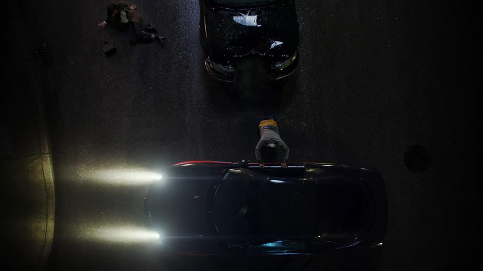 Julia Freeman pushes the car off of herself while Vanita looks on with shock.