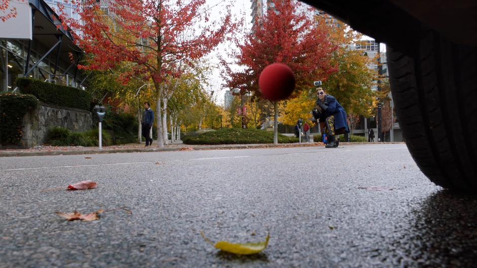 Axel Walker films as the exploding ball bounces under the taxi.