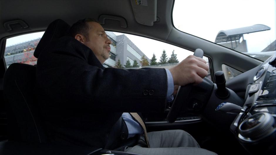 Councilman Grovner drives away from his home.