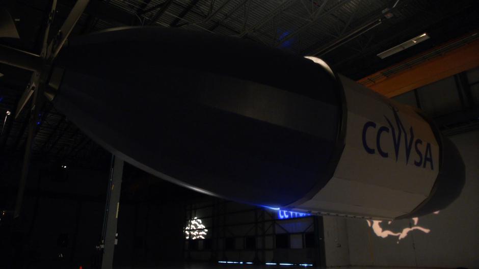 The fancy new weather blimp floats in the middle of the hanger.