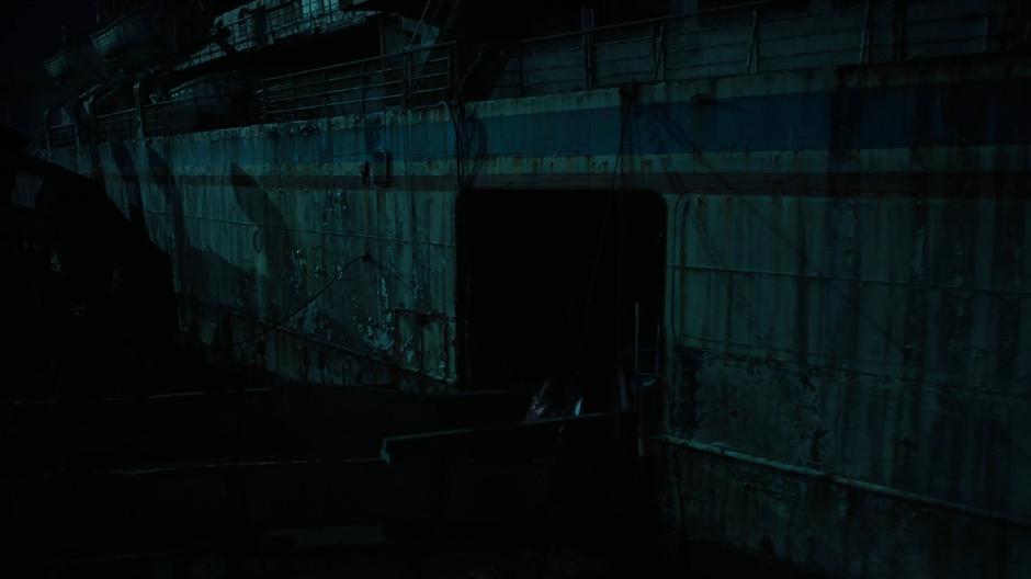 Brianna Stapleton enters the abandoned boat through the side door.