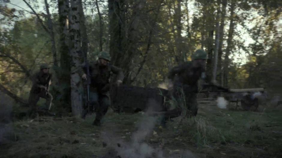 Quon, John James, and young Skinner run from enemy fire.