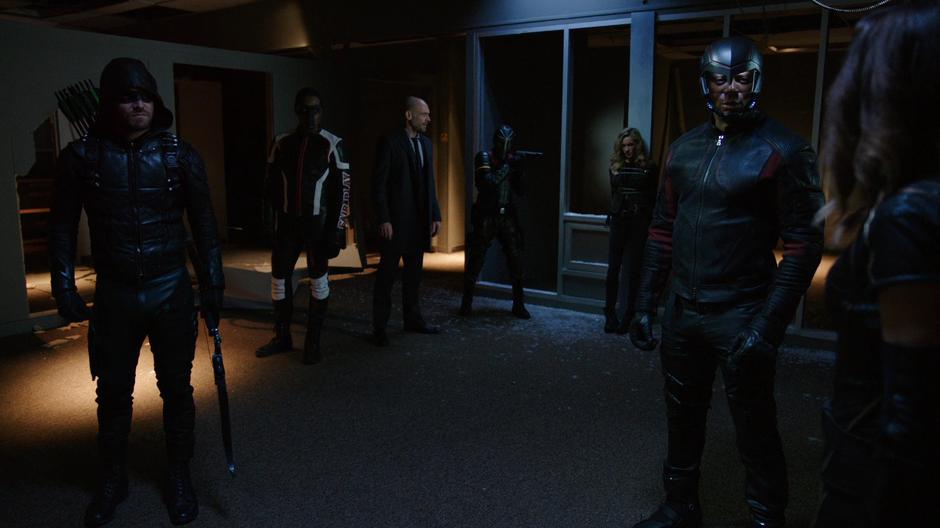 Oliver, Curtis, Lance, Rene, and Diggle talk to Black Siren and Dinah who are tied up.