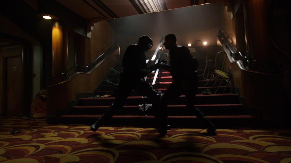 Diggle fights with Ricardo Diaz in the lobby.