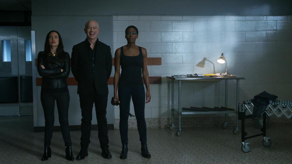 Darhk laughs at Ray while watching him record the message with Nora and Kuasa.