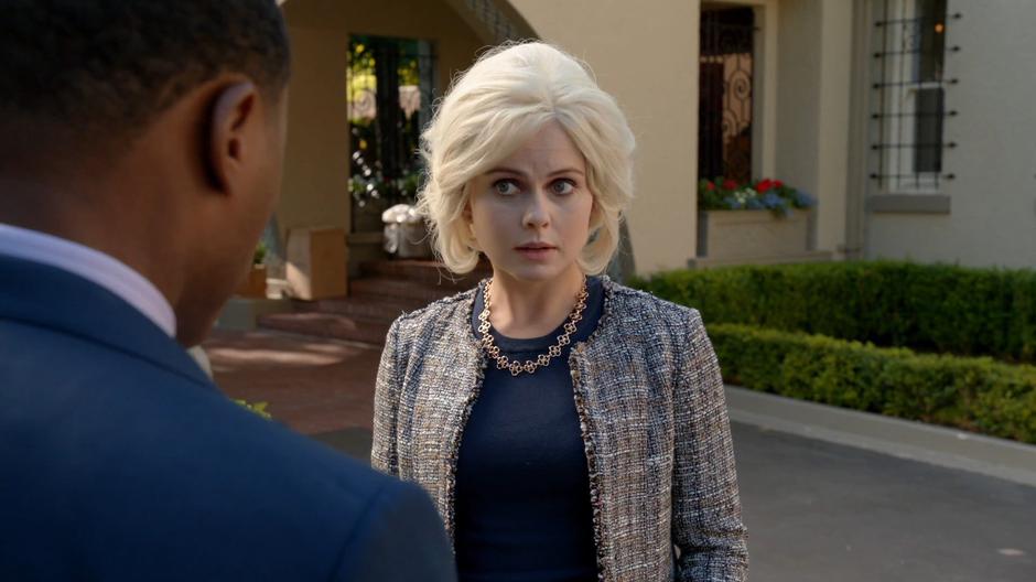Liv talks to Clive out front of the mansion.