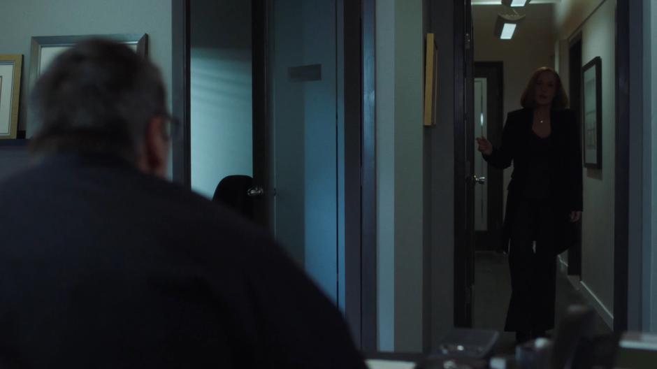 Scully knocks on the door to Chief Strong's office.