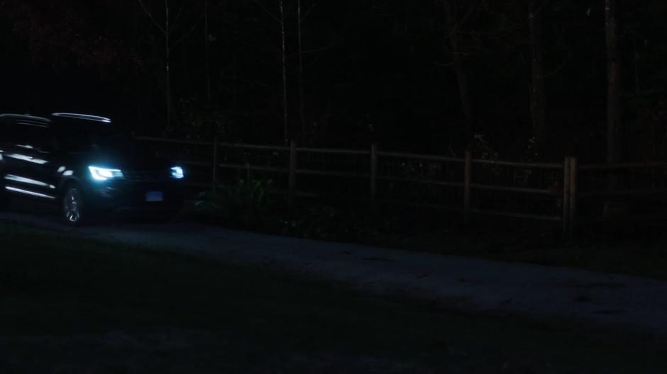 Mulder and Scully drive into the park at night.