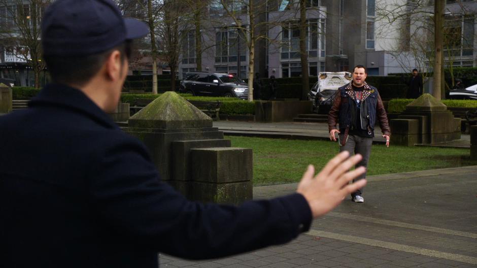 Matthew Kim holds up his hand as Jaco Birch yells an approaches him.