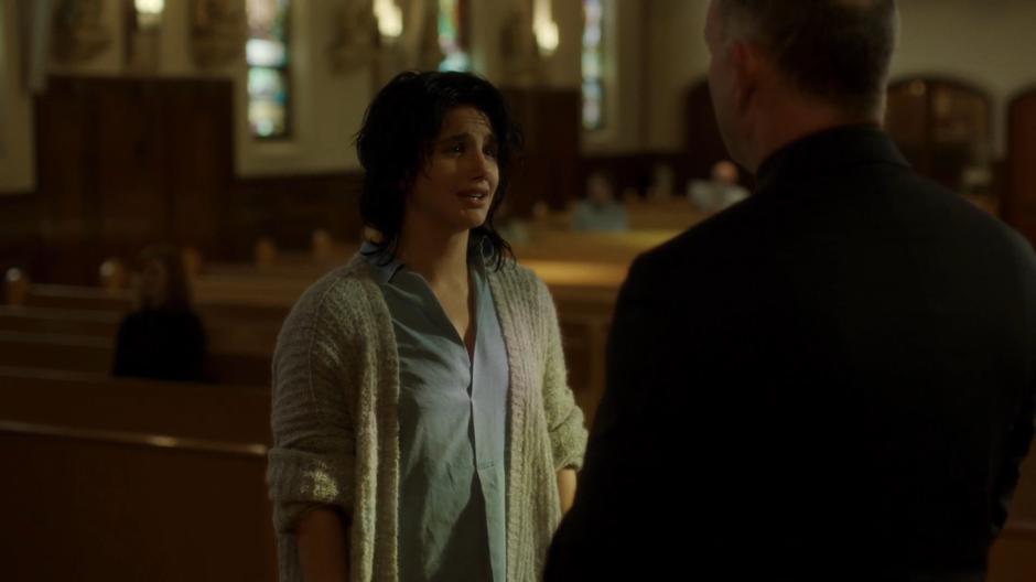 Juliet Bocanegra talks to Father Hardy at the front of the church.