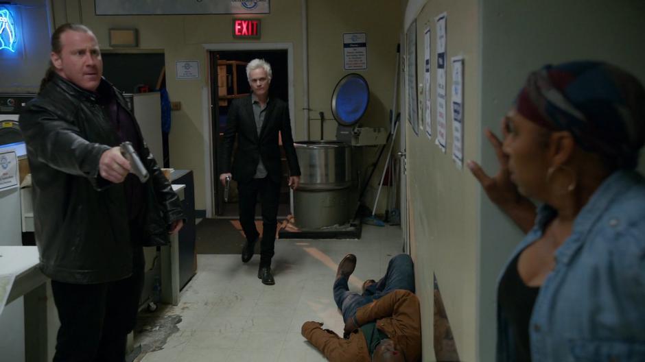 Mama Leone emerges from her hiding space while Dino holds her at gunpoint and Blaine walks in the door.