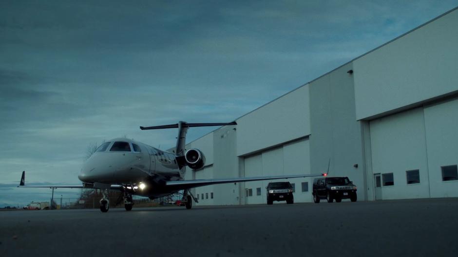 Mr. Y's private plane pulls to a stop in front of his hanger.