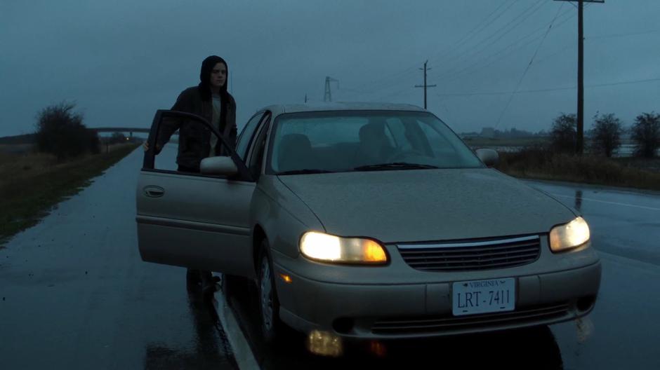 William gets into the car of one of Mr. Y's goons.