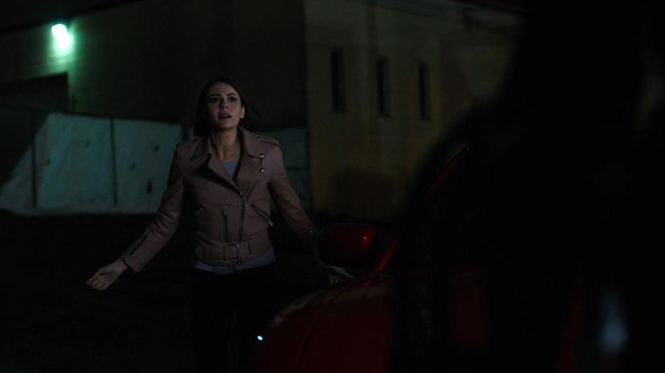Thea watches as Nyssa fights off the attackers.