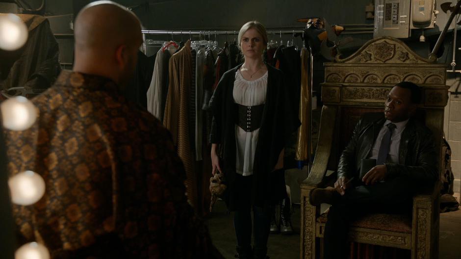 Liv stands nex to Clive as he sits in the throne to question Mordecai.